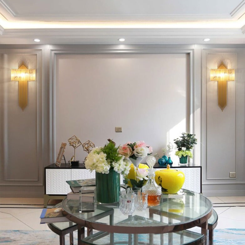 Pair of Alora wall lights flanking a dining space with elegant wall panelling and soft lighting.