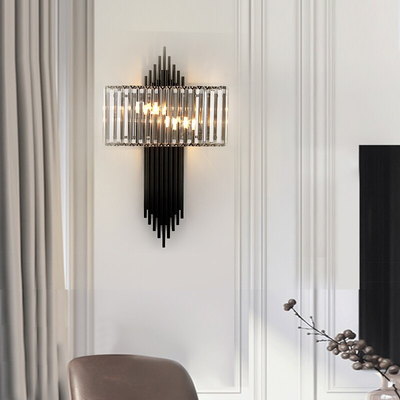 Side profile of the Alora wall light showcasing cascading crystal bars and warm illumination in a luxury interior.