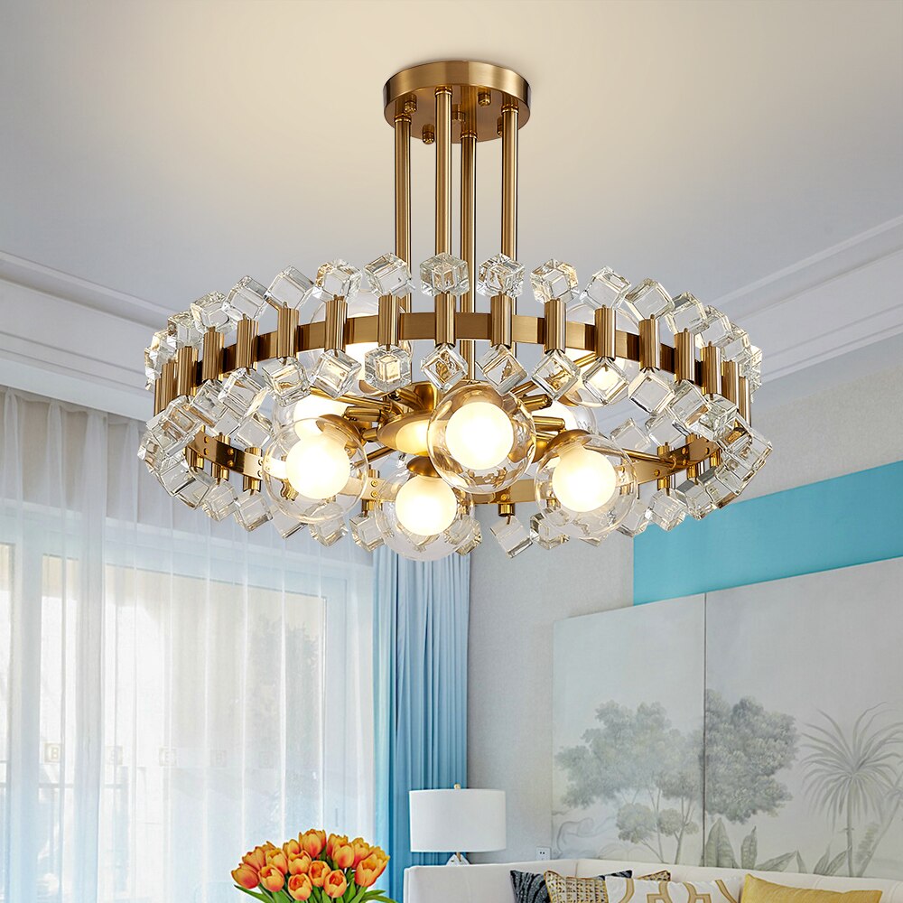 Alytus pendant with clear crystal tops and gold structure shown in a softly lit, modern interior.
