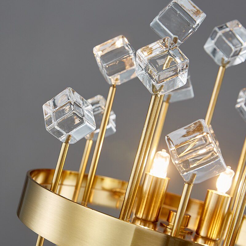 Detailed image of the Alytus Table Lamp showcasing geometric crystal cubes on gold rods.