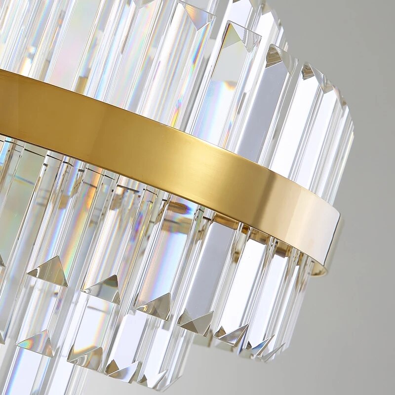 Close-up view of gold frame and vertically aligned crystal bars on the Belair chandelier.