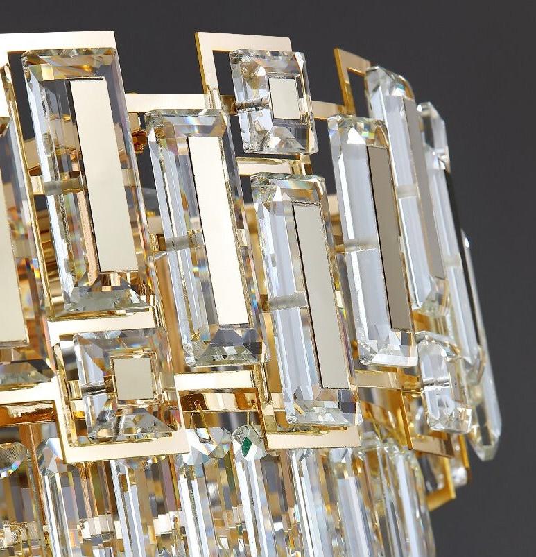 Angled close-up of gold-framed rectangular crystals on the Belvedere chandelier.