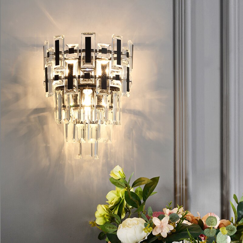 Luxury Belvedere wall light with mixed crystal bars illuminating a refined interior.