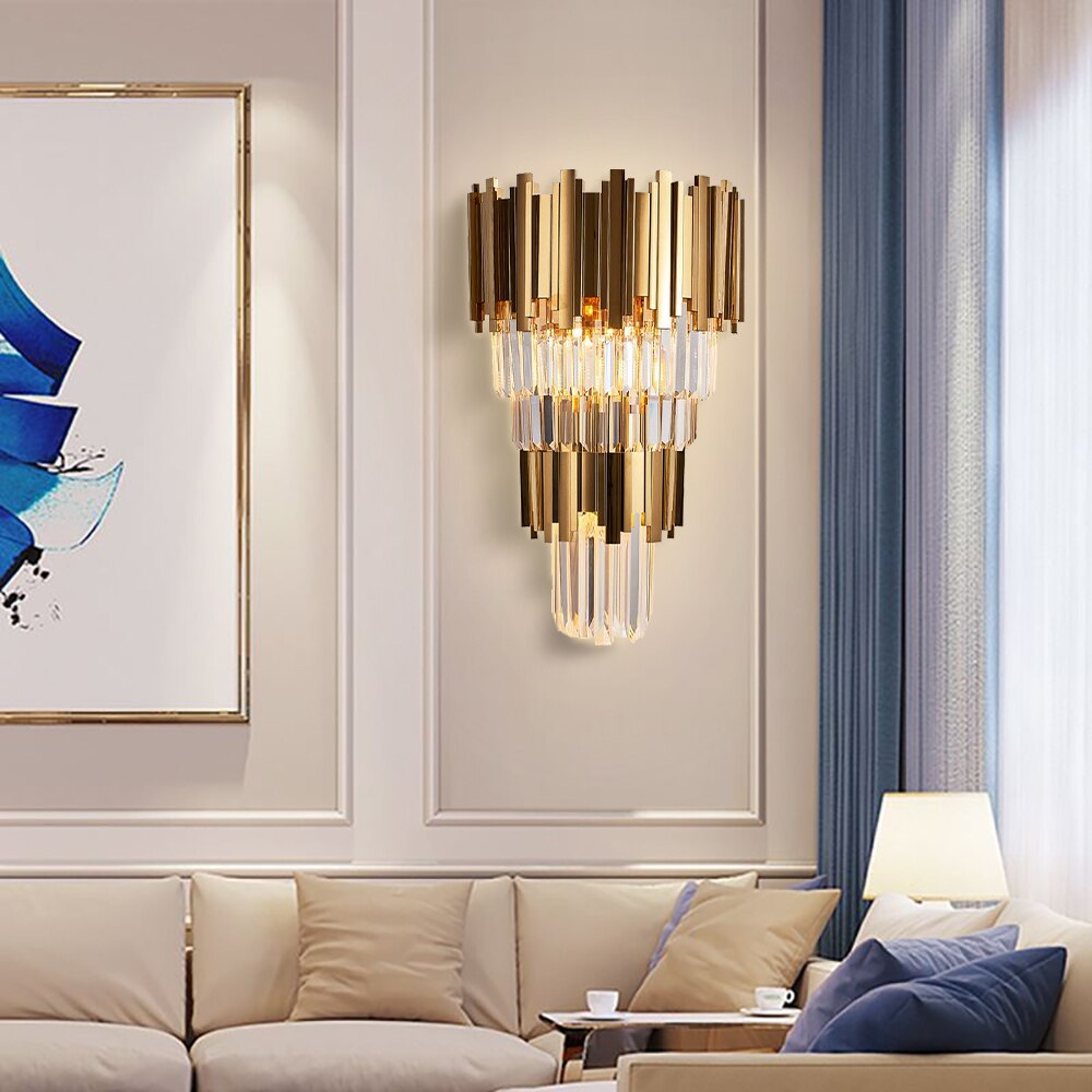Boeotia Double Wall Light with gold cuboid tubes and crystal bars illuminating a luxury living room.