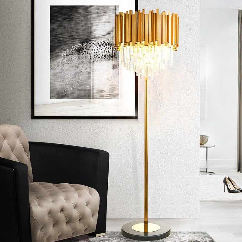Boeotia Floor Lamp featuring gold cuboid tubes and crystal bars standing in a luxury modern living room.