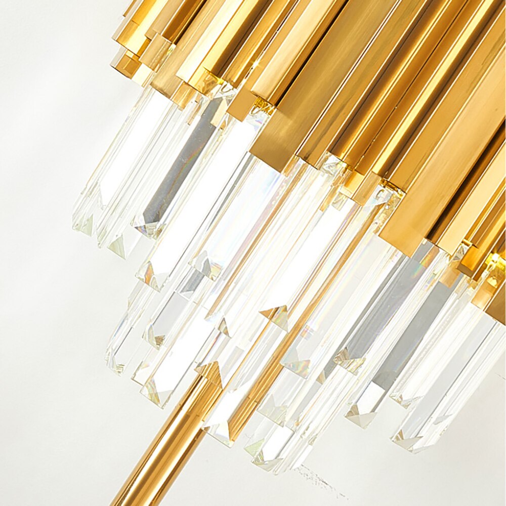 Close-up of the Boeotia Table Lamp’s polished gold tubing and faceted crystal bars.