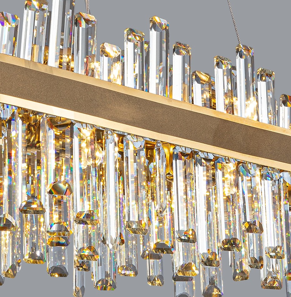 Detailed view of Brighouse chandelier crystals set against a refined brushed frame.