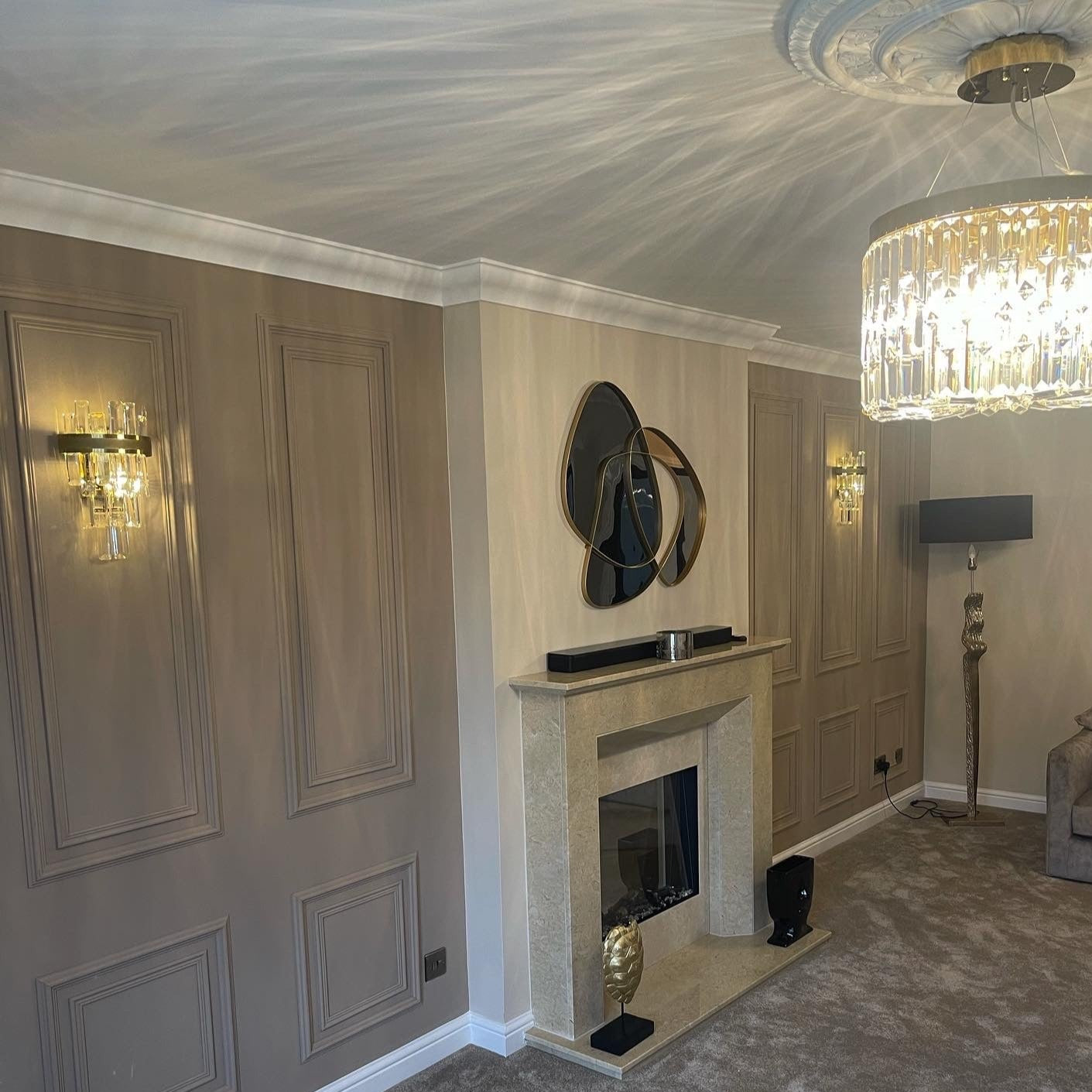 Brighouse Wall Light illuminating a refined living space with soft, contemporary ambience and crystal detailing.