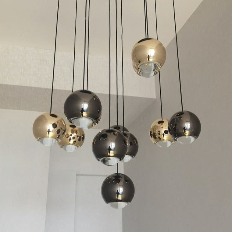 Close-up of the Carlito Staircase Chandelier featuring clustered metallic spheres in modern minimalist design.