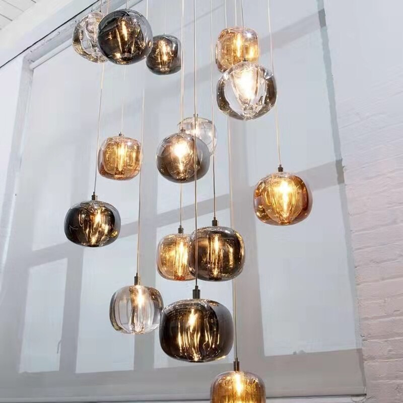 Luxury glass sphere pendant chandelier illuminating grand entrance void space by VORELLI®