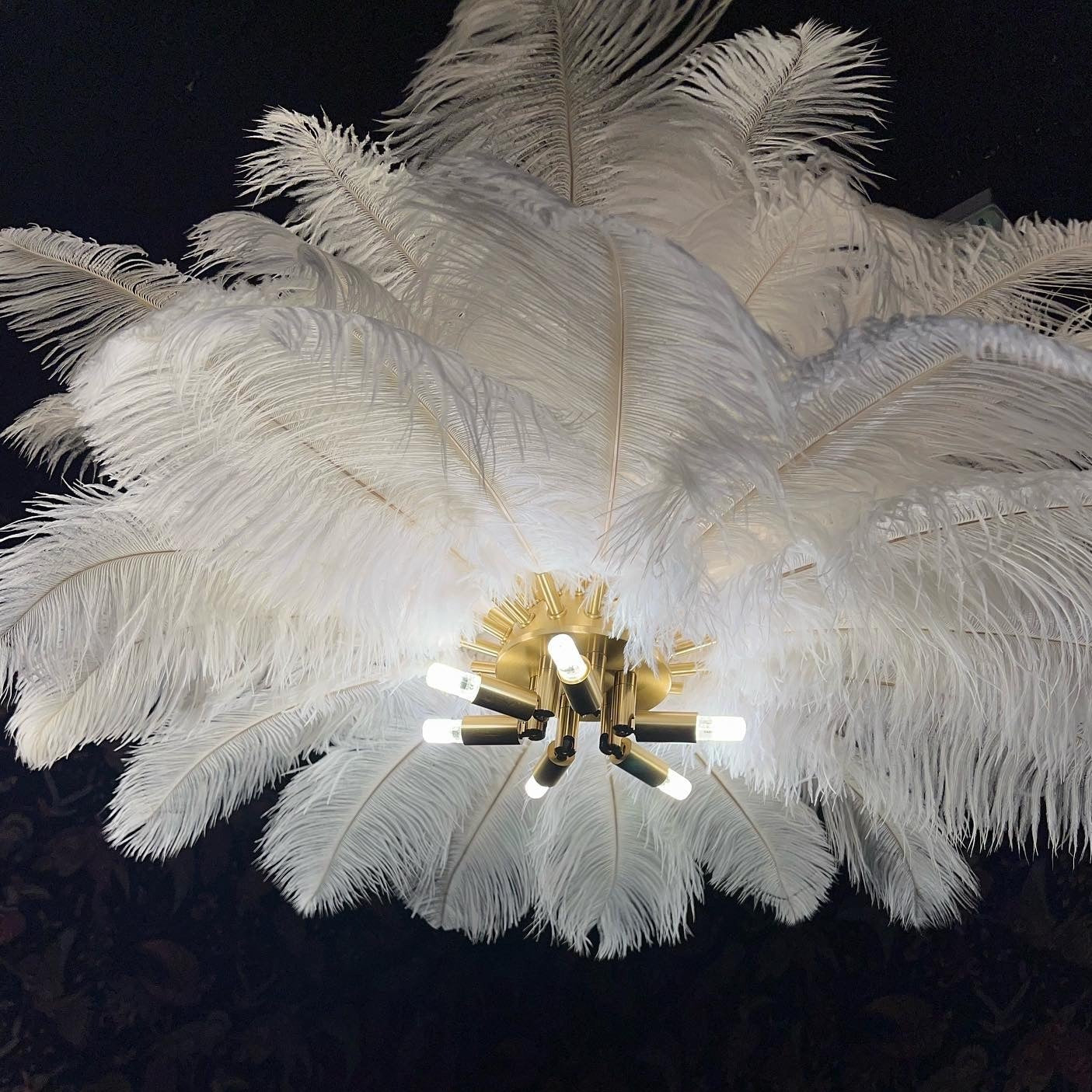 Feather pendant light with layered feather shade detail