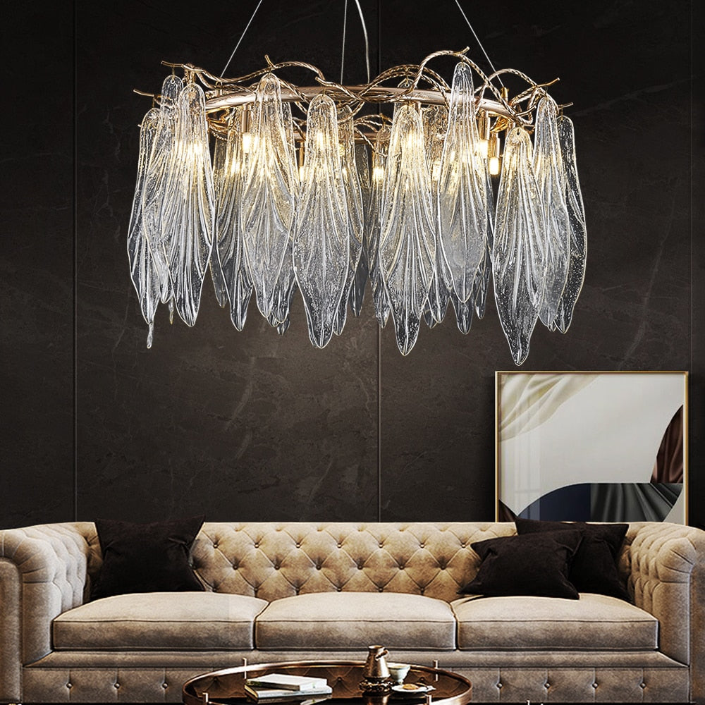 Larvotto circular chandelier by VORELLI® with sculptural branches and leaf glass in a luxury living space