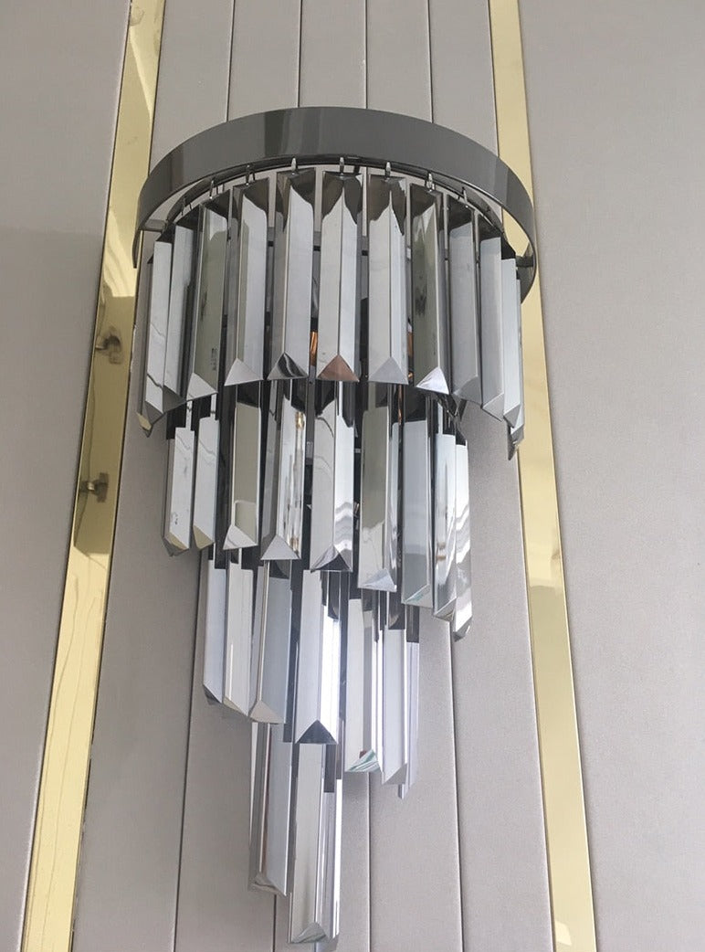 Close view of polished crystal bars on the VORELLI Margoux wall light highlighting clarity reflection and luxury finish