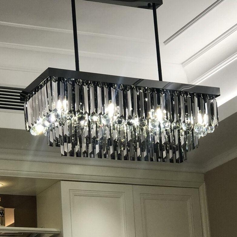 Modern VORELLI Margoux rectangular chandelier featuring layered crystal bars and spheres forming a striking ceiling focal point