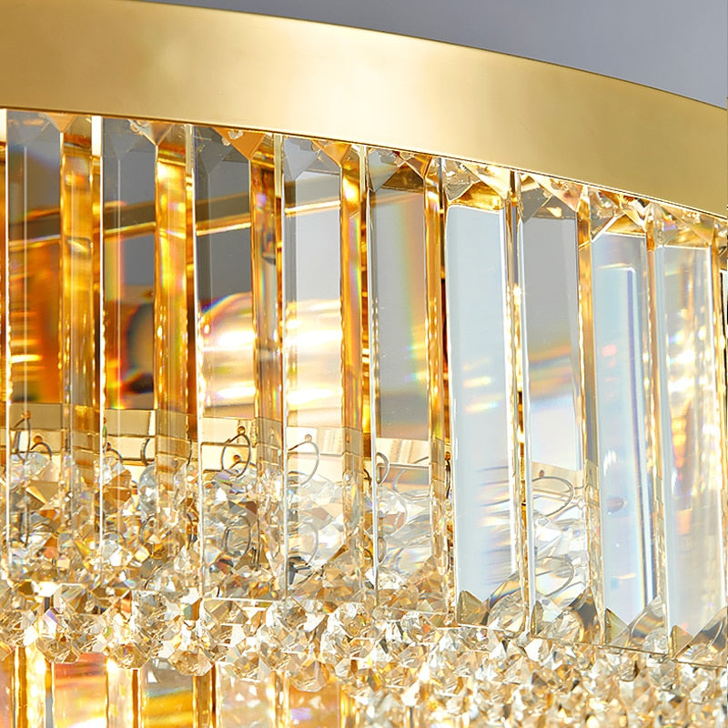 Detailed view of gold frame and vertical crystal bars on the VORELLI Merlimont circular chandelier