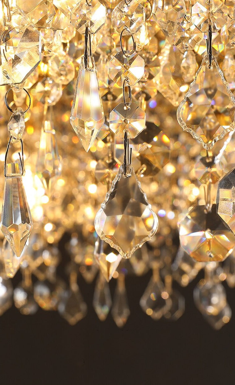 Close up of VORELLI® Modesto crystal ceiling light highlighting cascading diamond cut octagon crystal chains with warm illumination