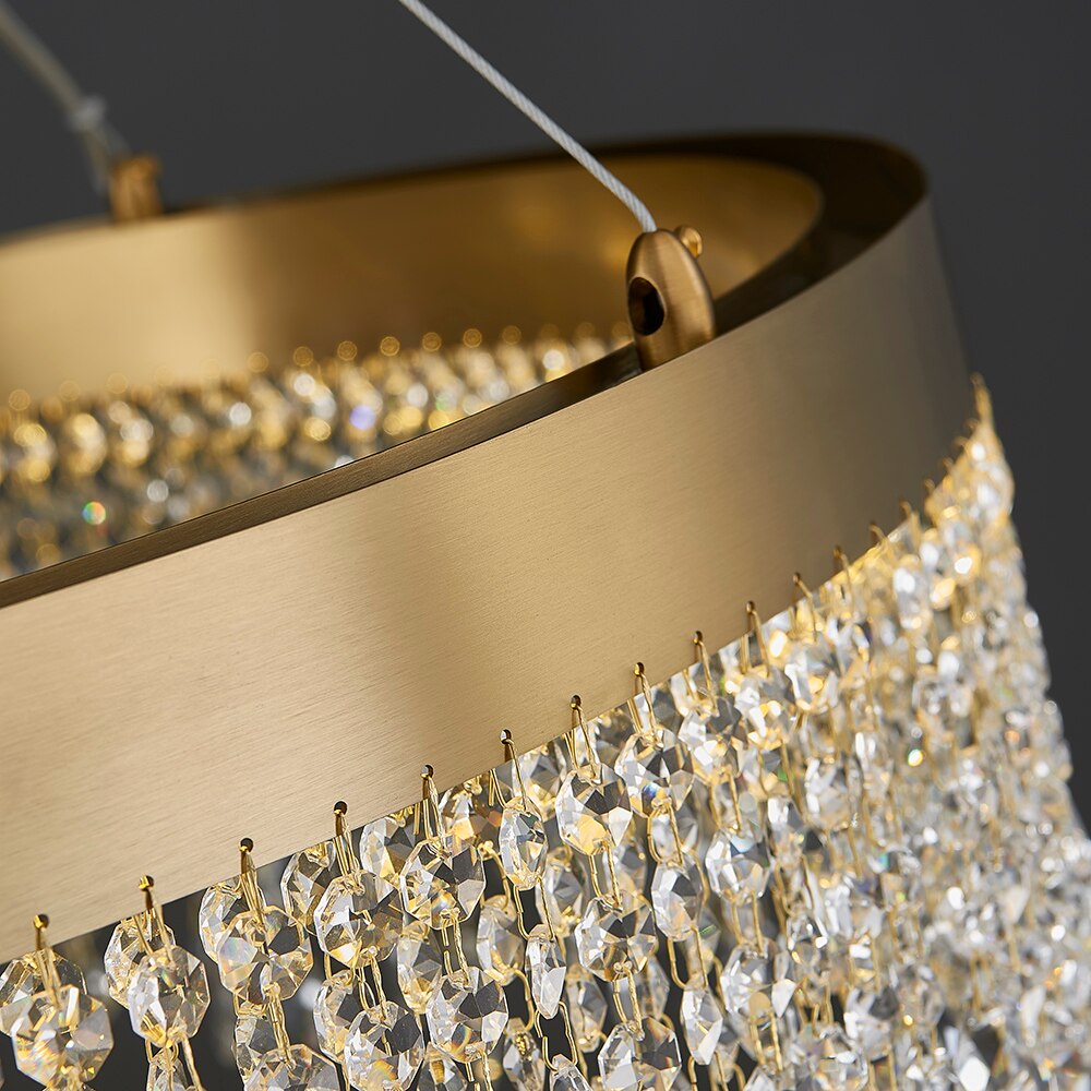 Close up of VORELLI® Modesto circular chandelier showing structured frame and cascading crystal chains