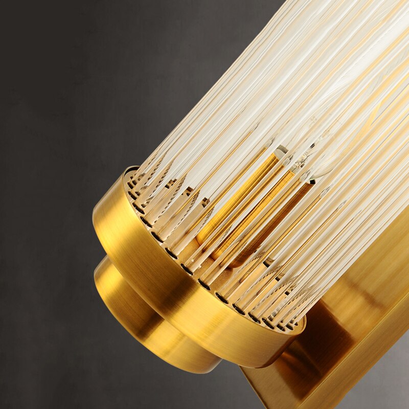 Detailed view of illuminated crystal tubes on VORELLI® Mykonos luxury wall sconce creating refined ambient glow