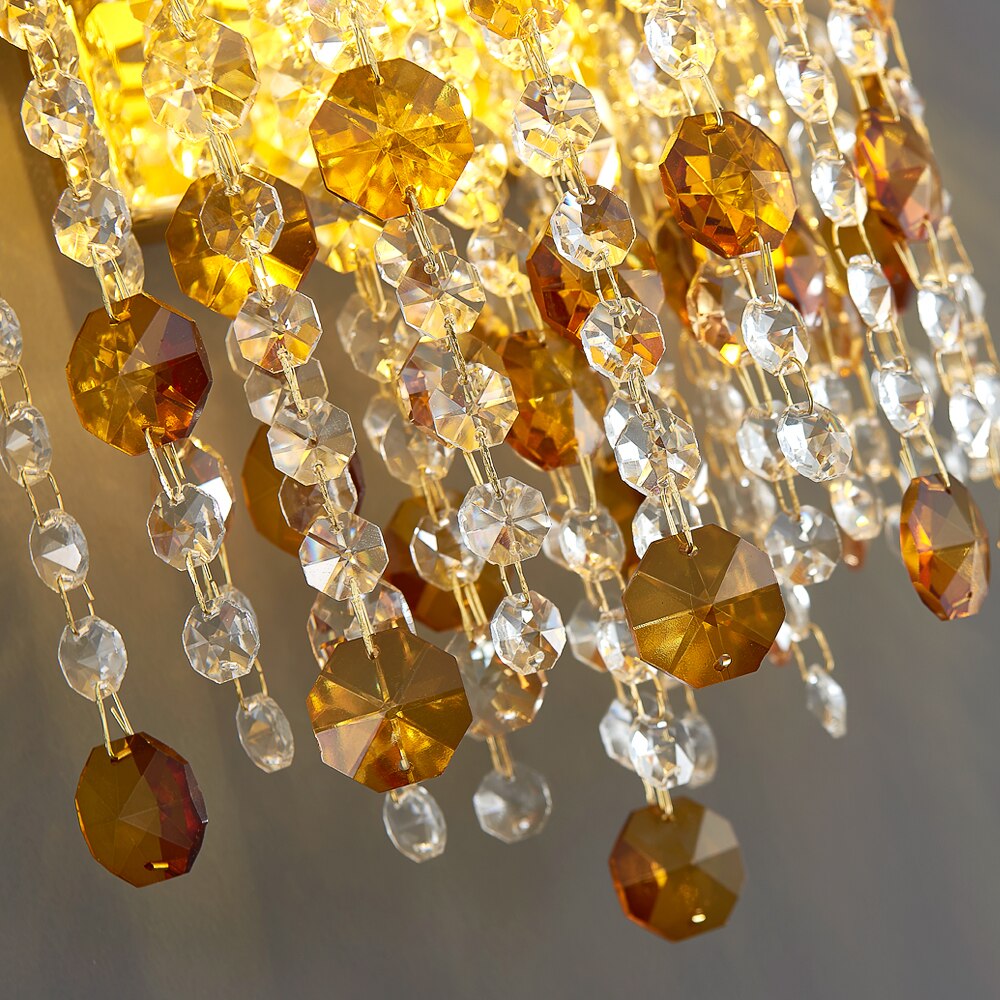Detailed view of diamond cut octagon crystal chains on VORELLI® Owensboro wall sconce