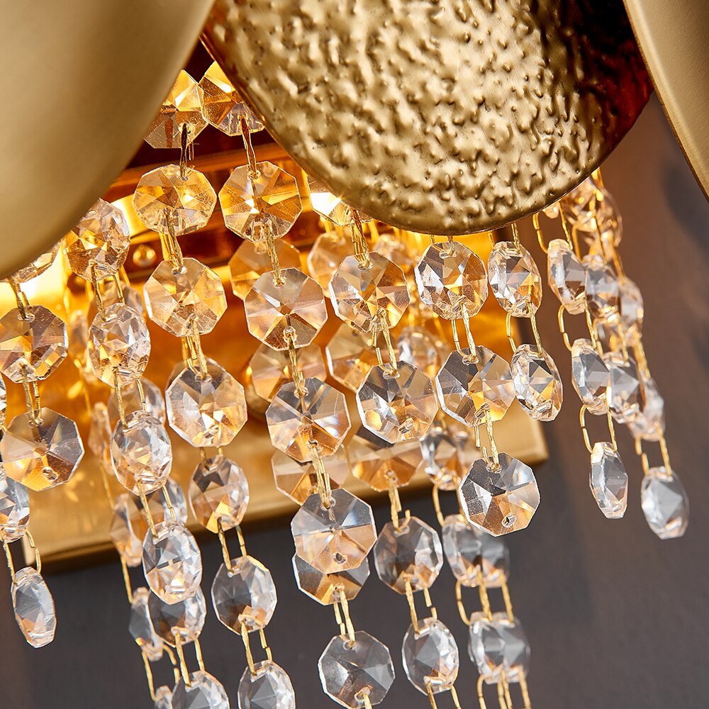 Close up of diamond cut octagon crystal chains on VORELLI® Palatino wall light