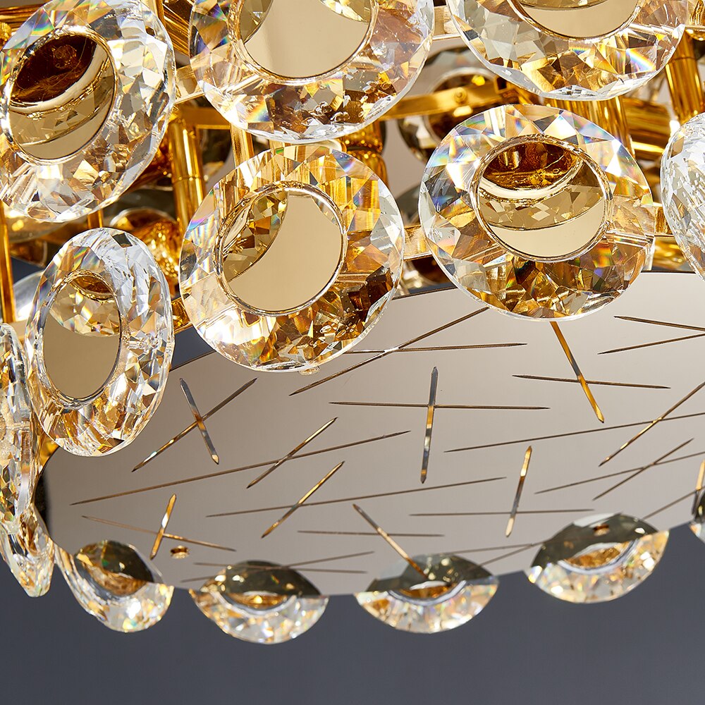 Close up of diamond cut crystal discs and circular metal detailing on VORELLI® Patara ceiling light