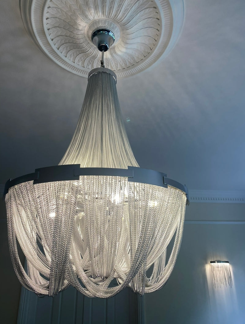 Crystal Chandelier - A mesmerizing centerpiece illuminating luxury living space from Vorelli's curated collection.