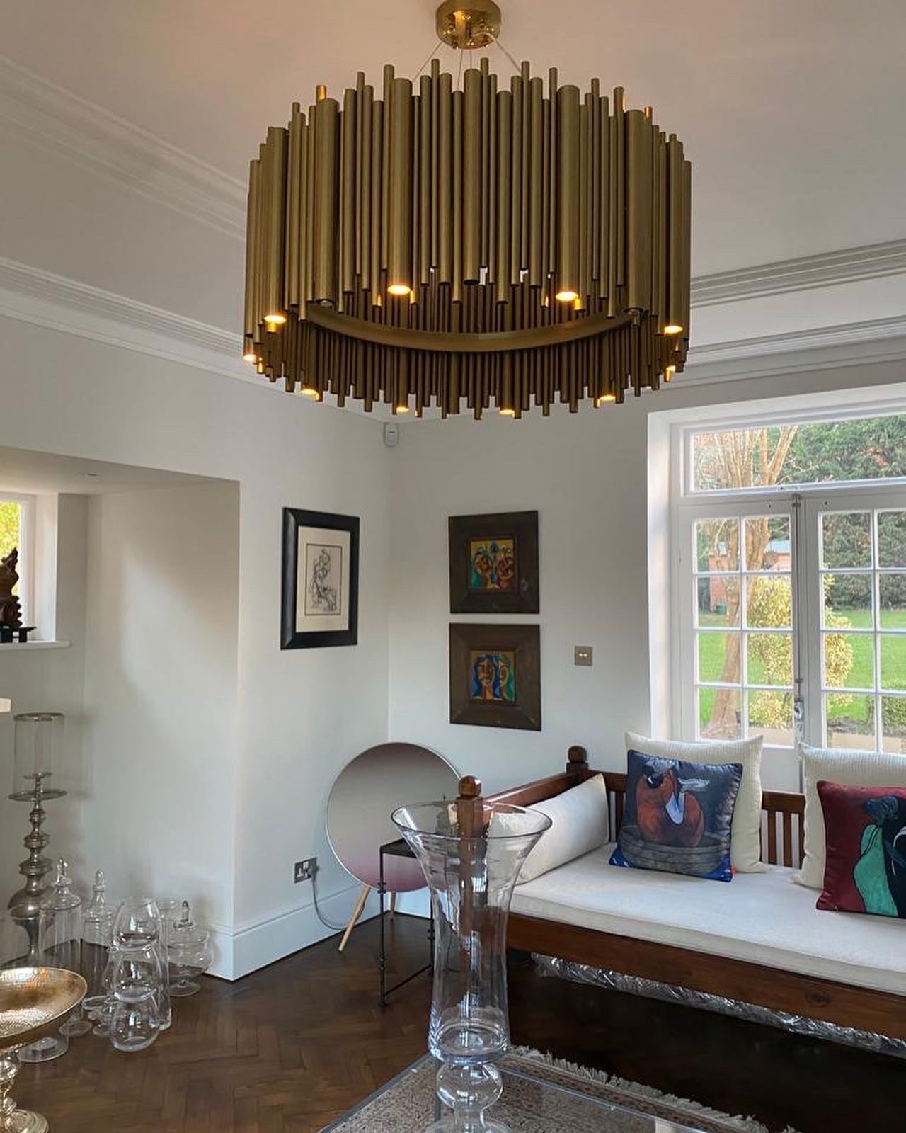 Elegant pendant light from Vorelli Lighting's Vitacura Collection, featuring a sleek design with a brushed gold finish, hanging delicately above a dining table.