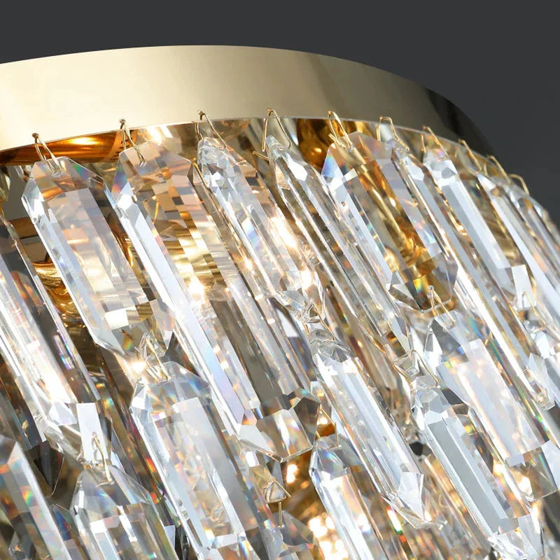 VORELLI® Abruzzi Series luxury crystal lighting with cascading diamond cut crystals, designer chandeliers, pendants, and wall lights for staircases, dining rooms, and global interiors.