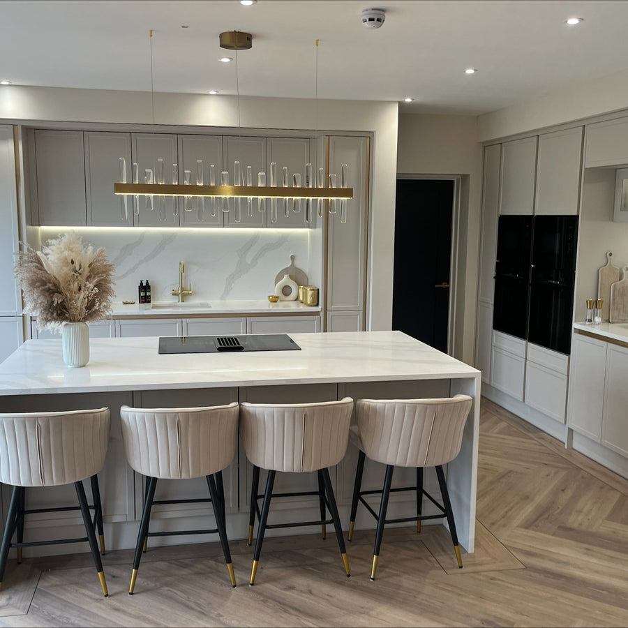 VORELLI rectangular chandelier above a kitchen island and dining space
