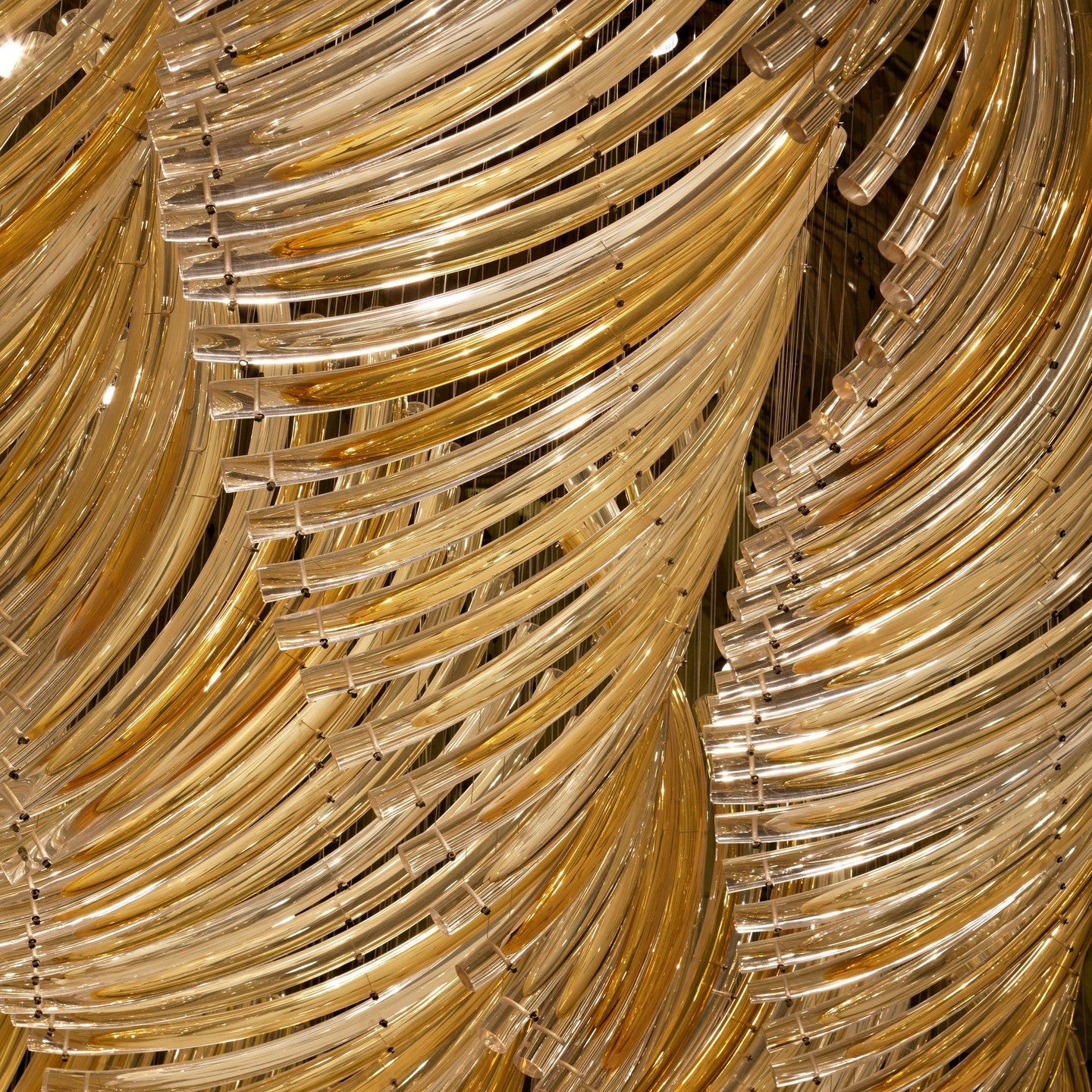 Amber Gradient Bent Glass Tube Project Installation