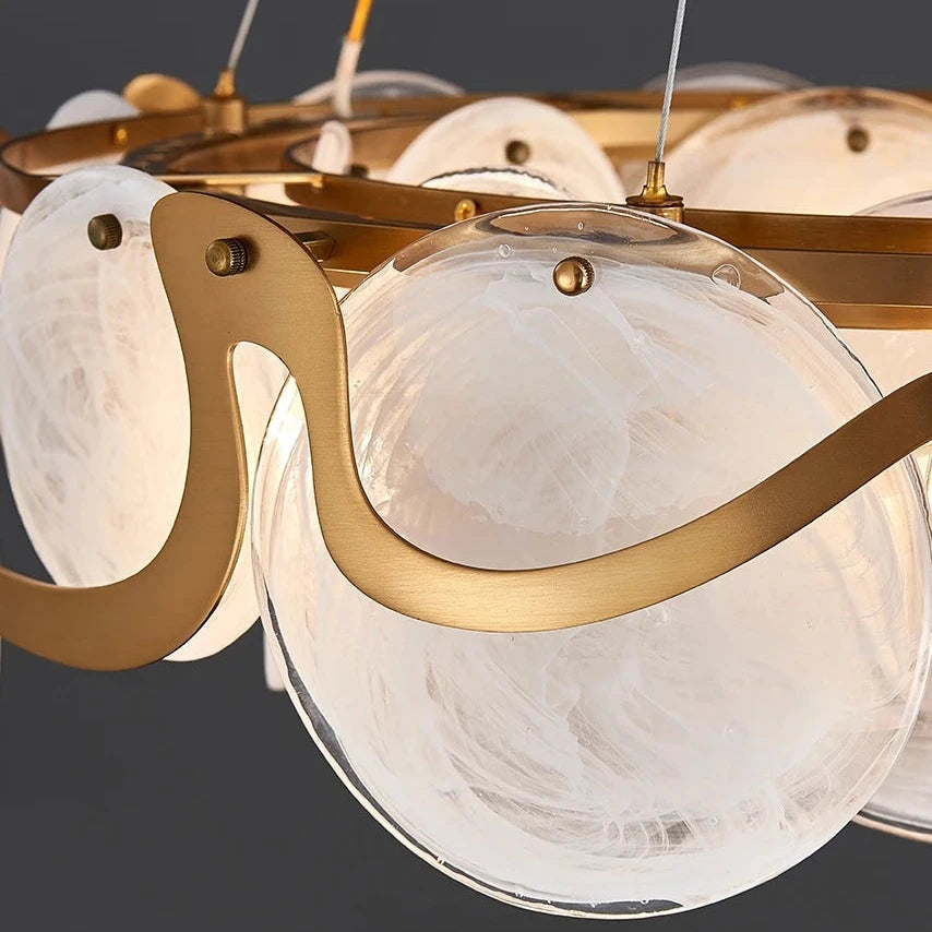 Valparaiso Cristóbal circular chandelier illuminating a refined dining space with layered hand-blown glass discs