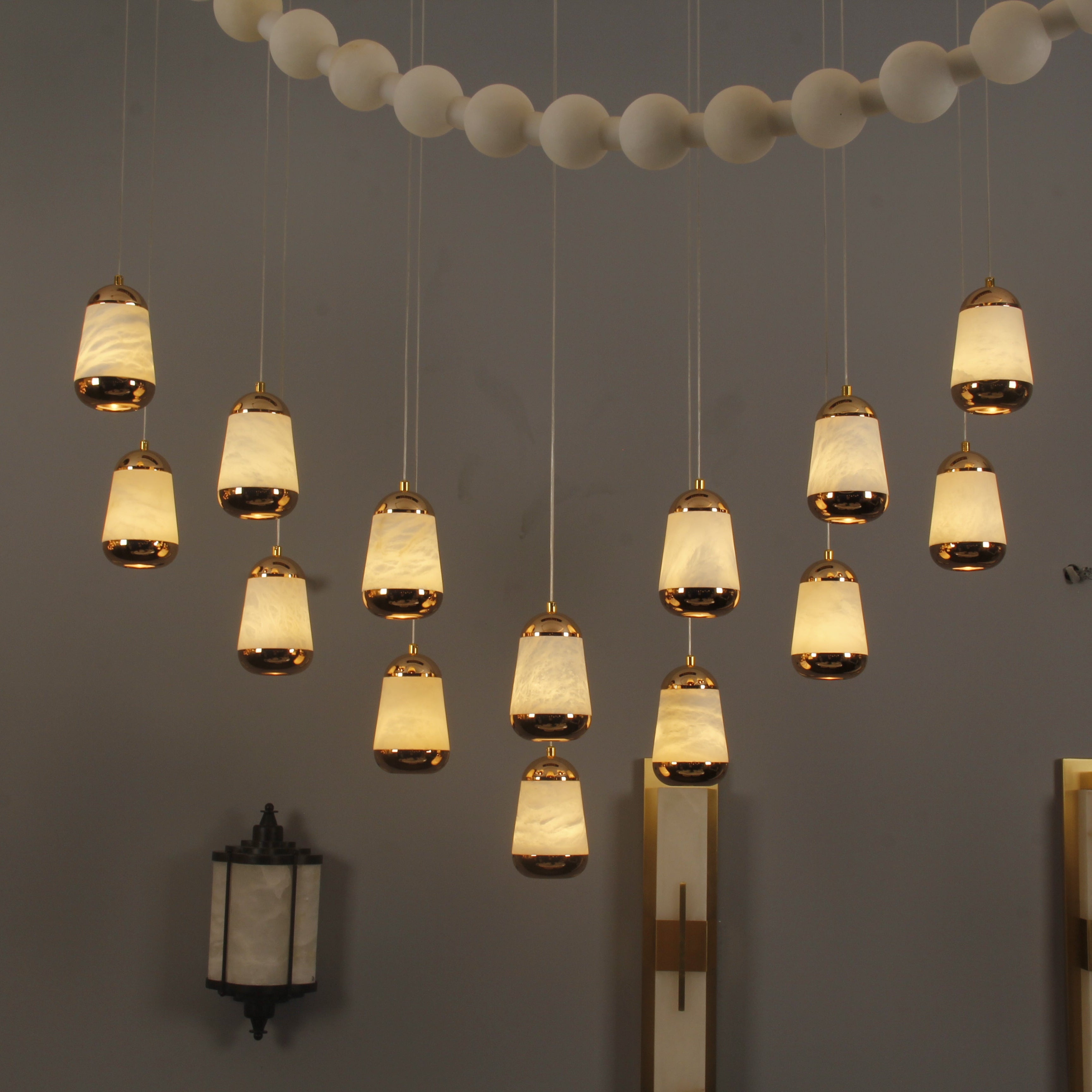 Giovanni rectangular chandelier featuring marble-effect teardrop pendants in a luxury interior setting
