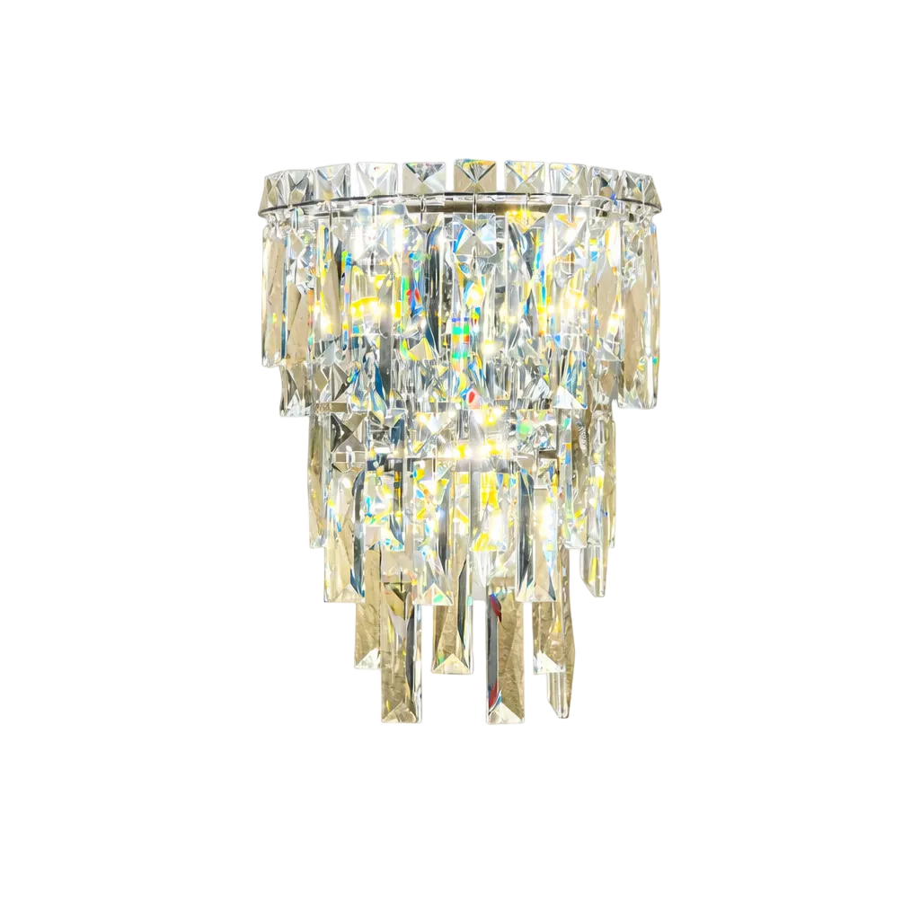 Luxury tiered crystal wall light with cascading faceted rectangular prisms suspended from a polished circular metal frame, emitting a warm radiant glow and isolated on a pure white background.