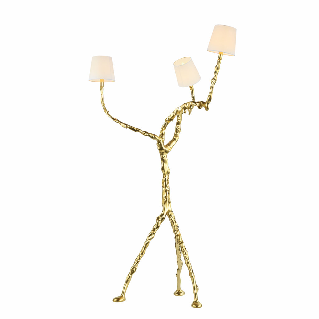 Luxury sculptural gold floor lamp with branching organic form, three white fabric lampshades, and tripod-style base on a pure white background.