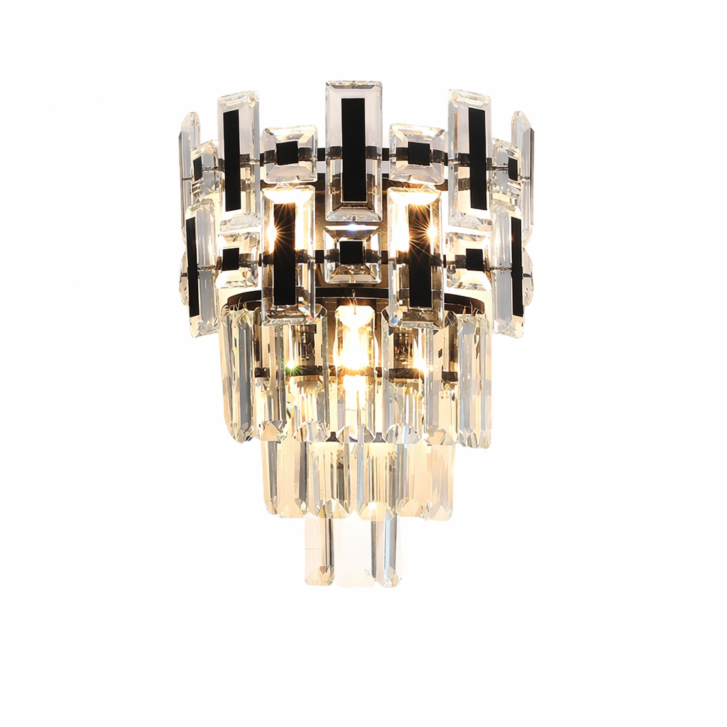 Luxury crystal wall light with clear rectangular faceted crystals, black inlay detailing and warm illuminated centre, isolated on pure white background for VORELLI®