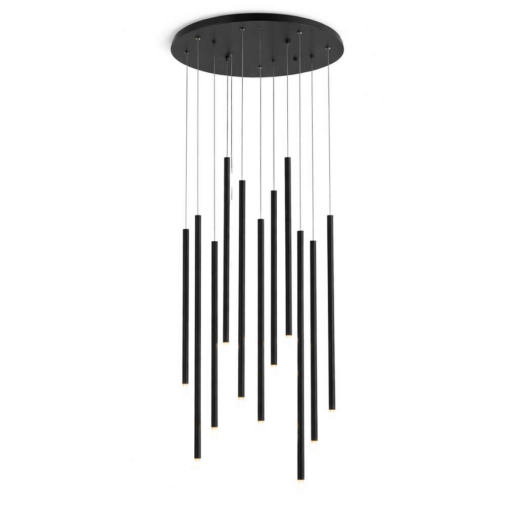 Ambiance-focused view of the VORELLI Liscio chandelier showcasing the warm, sophisticated glow emitted by the cascading cylinder pendants.