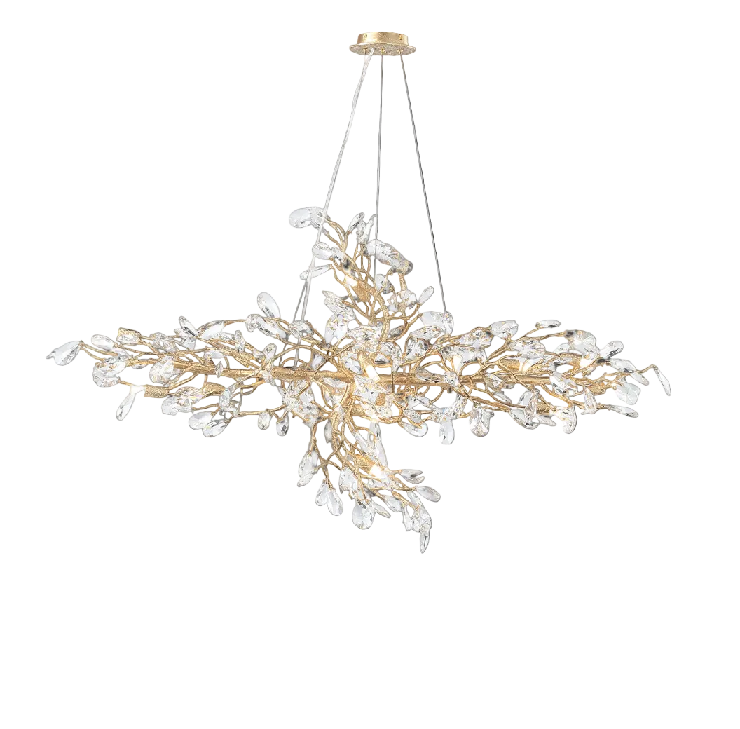 An atmospheric view of the VORELLI Entwine rectangular chandelier, emphasizing the intricate sculptural movement of the gold branches and the subtle brilliance of its crystal drops.