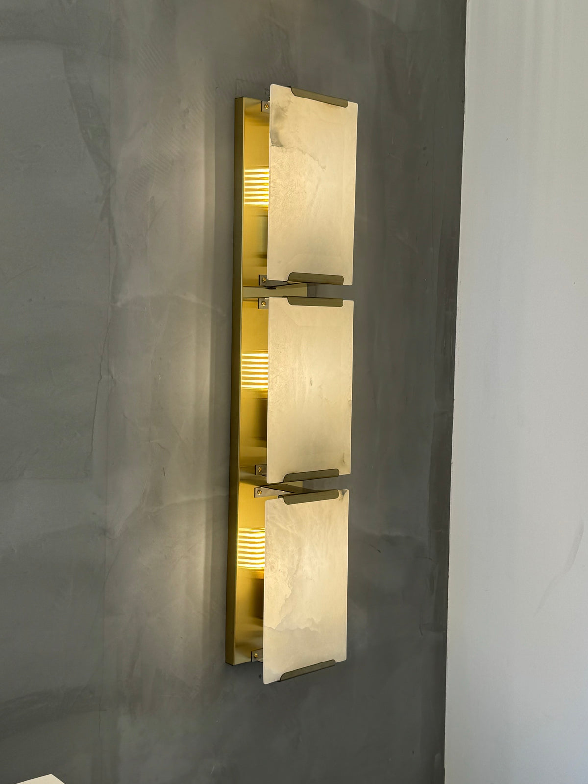 Front-facing image of Angel Marble Wall Light II highlighting marble texture and sleek vertical silhouette.