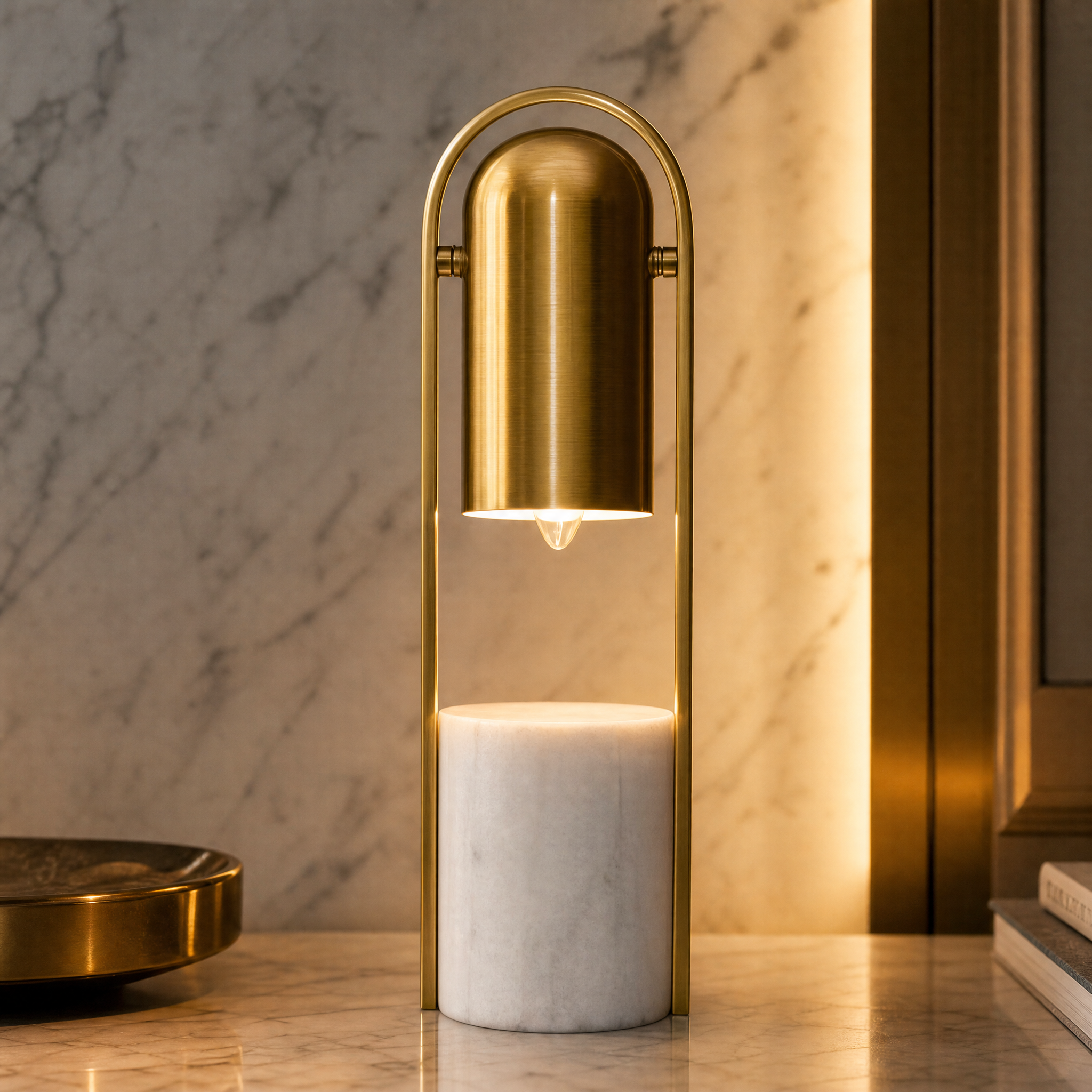 Close-up detail of the VORELLI Archeon table lamp showing the sculpted white marble base and antique brass accents.