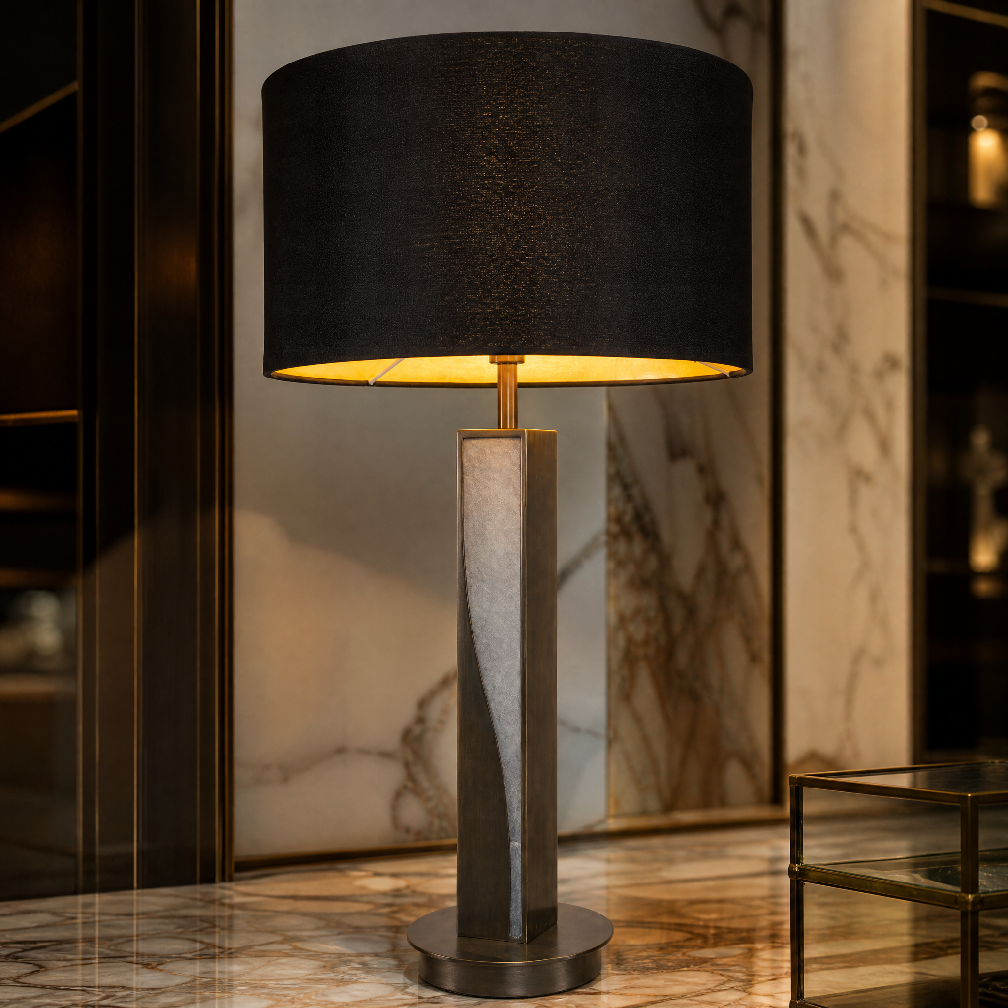 A detailed close-up of the VORELLI Arzano Table Lamp highlighting the contrast between the sculpted natural alabaster base and the rich dark bronze metallic detailing.