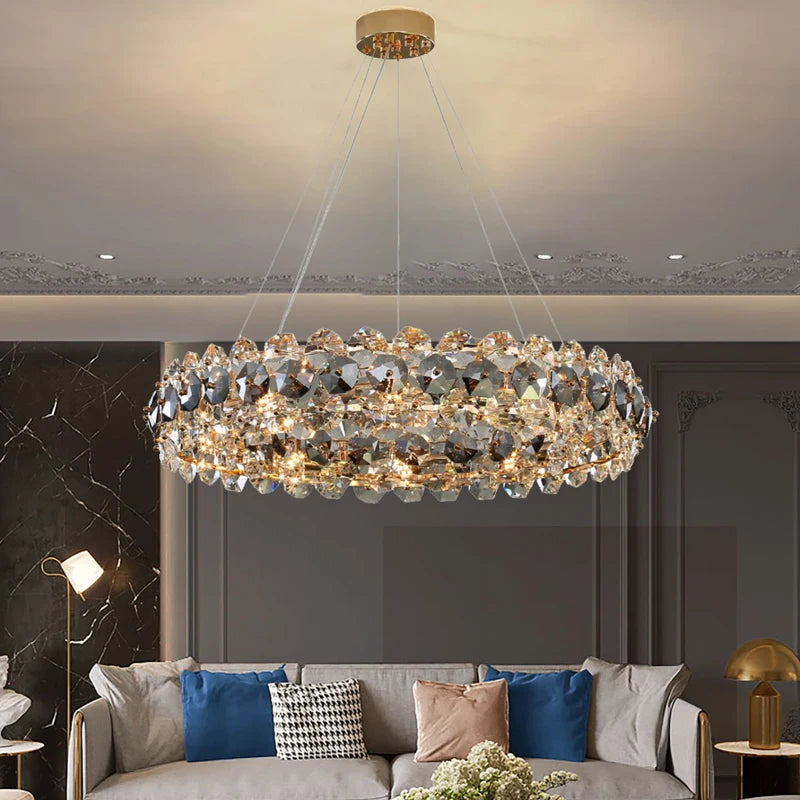 Astoria Circular Chandelier suspended over dining table, showcasing clear and smoky grey crystal ring design.