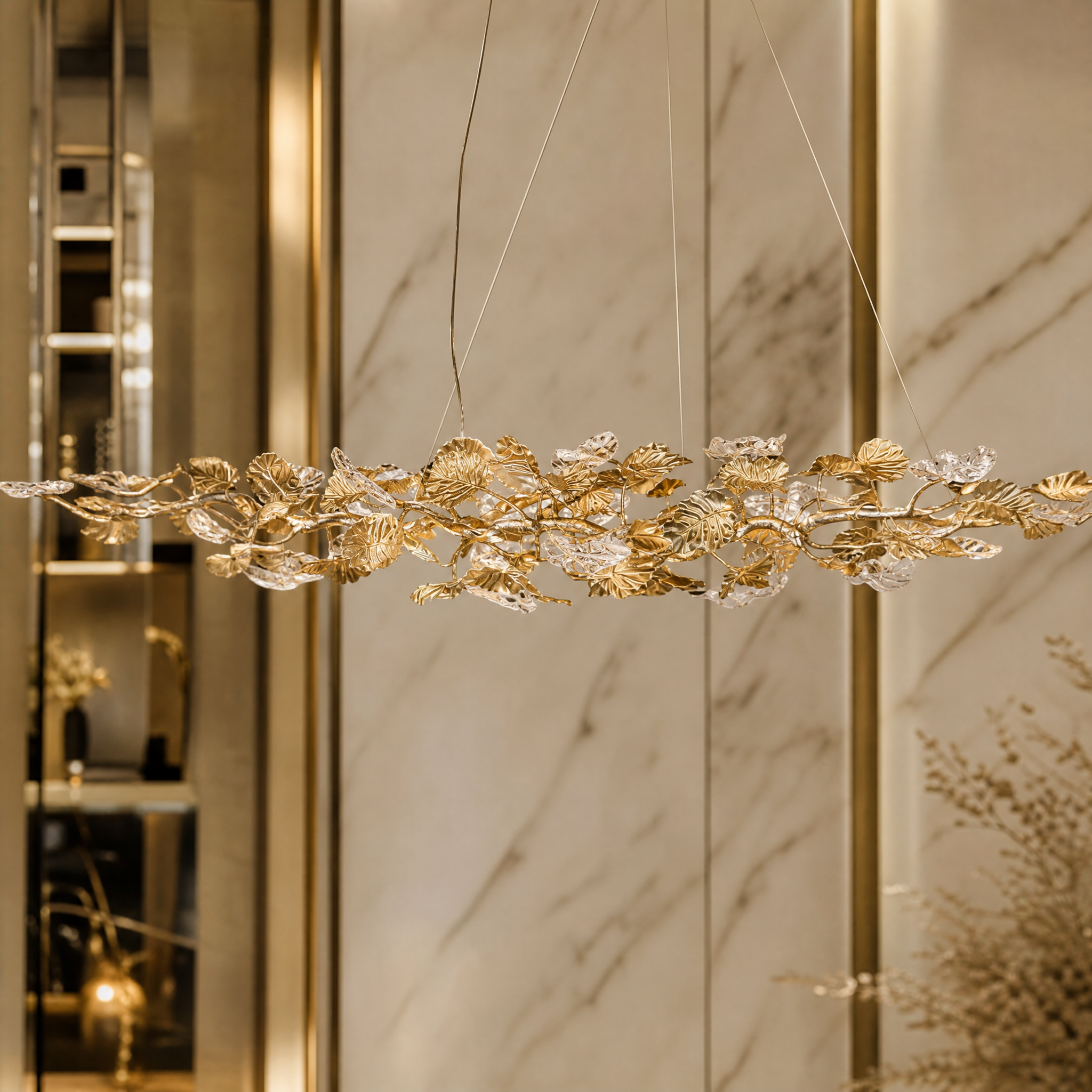 Close-up of the delicate glass leaf craftsmanship and metal structure of the VORELLI Aura Leaf Rectangular Chandelier.