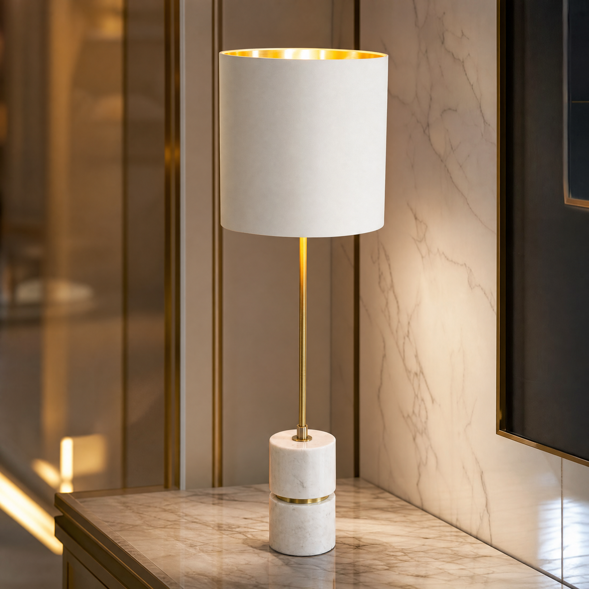 Detailed closeup of the Aurevia lamp showing the premium white marble base and slender antique brass stem