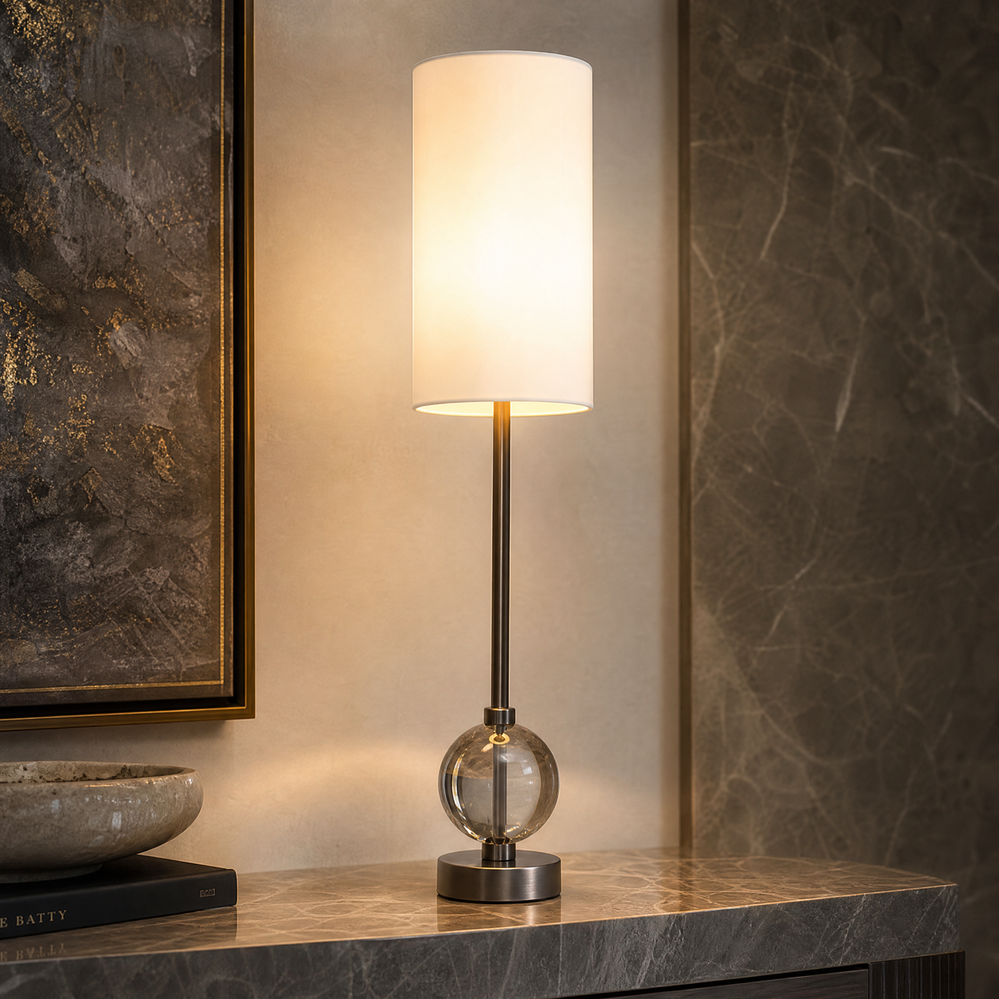 Macro view of the VORELLI Aurezza lamp showing the refined crystal sphere base and polished gunmetal stem texture.