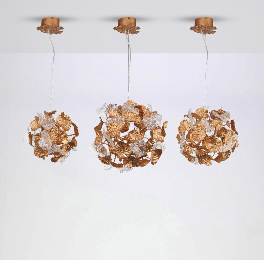Trio of Autumn Bloom Pendants with sculpted metallic foliage and warm glow.