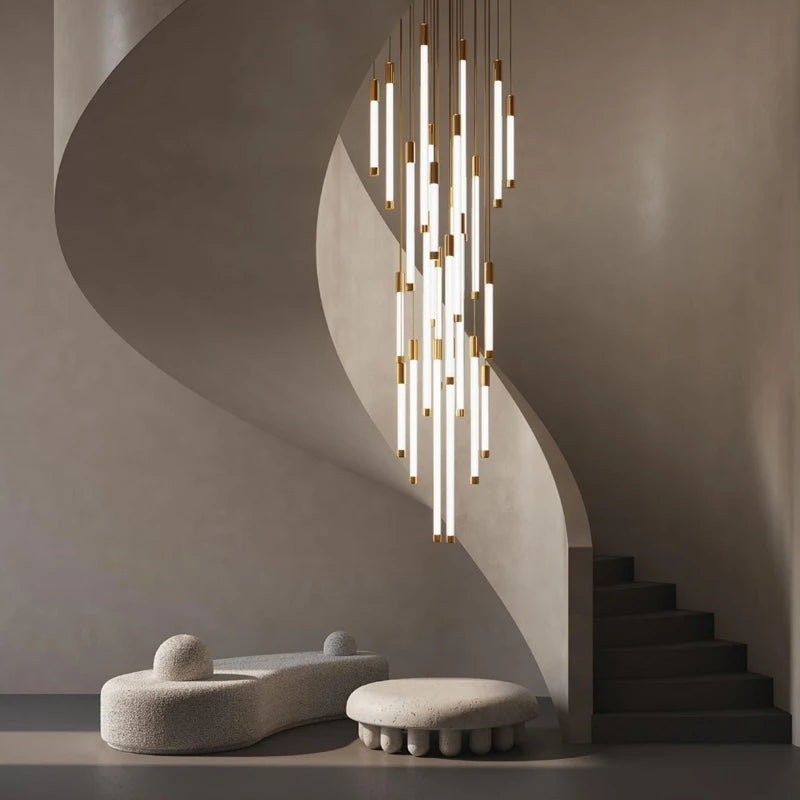 Avezzano Staircase Chandelier with vertical pendant tubes illuminating a curved staircase.