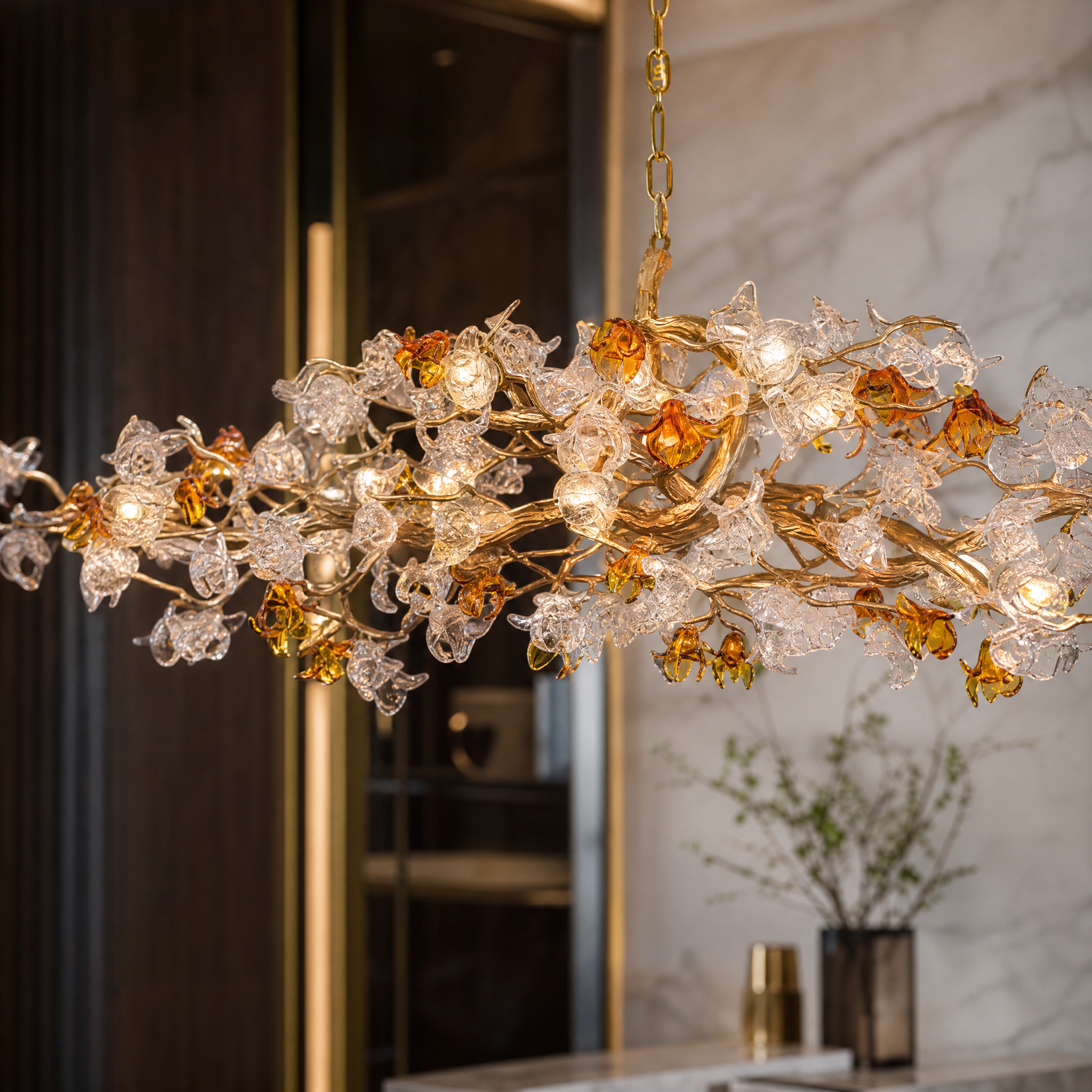 Close up detail of VORELLI Bloom rectangular chandelier glass petals with subtle amber accents