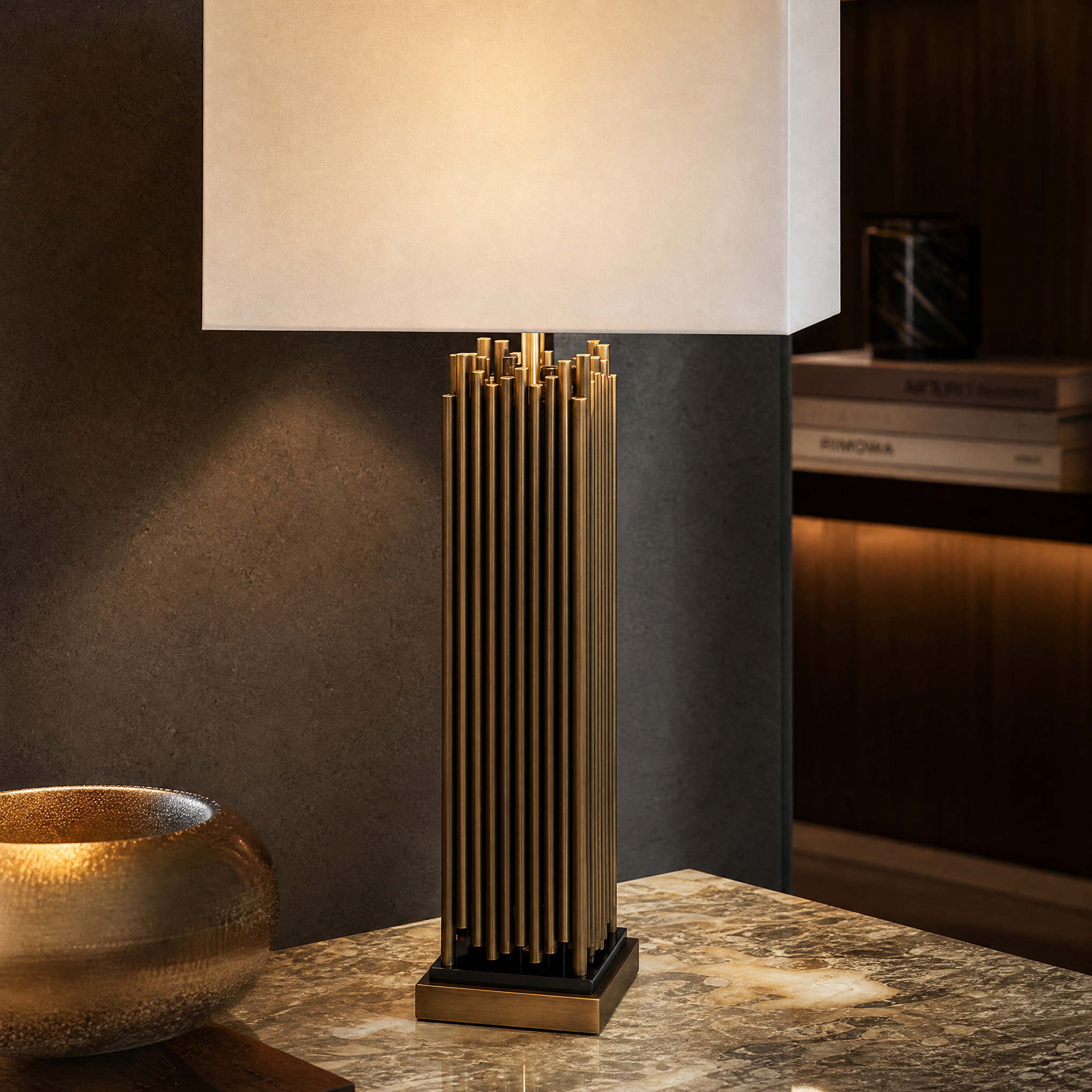 Close up view of the Bravion table lamp showing intricate antique brass detailing and the refined black marble base texture.