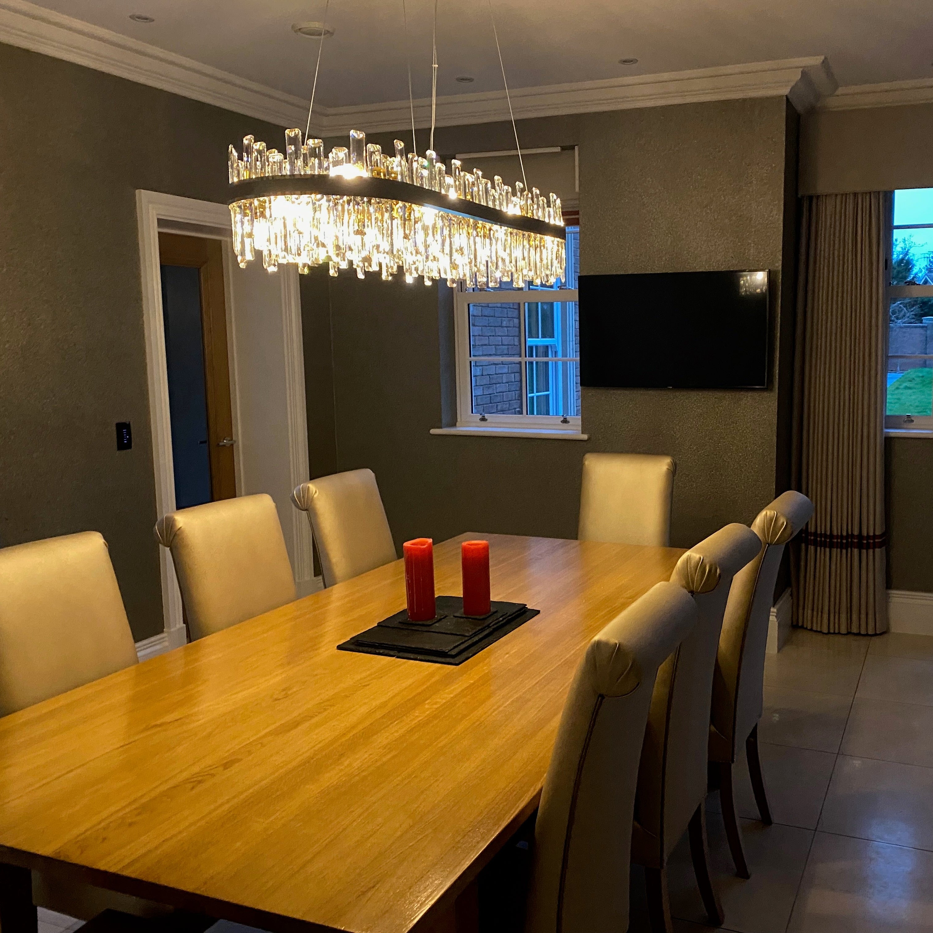 Illuminated Brighouse rectangular chandelier showcasing faceted crystal detailing