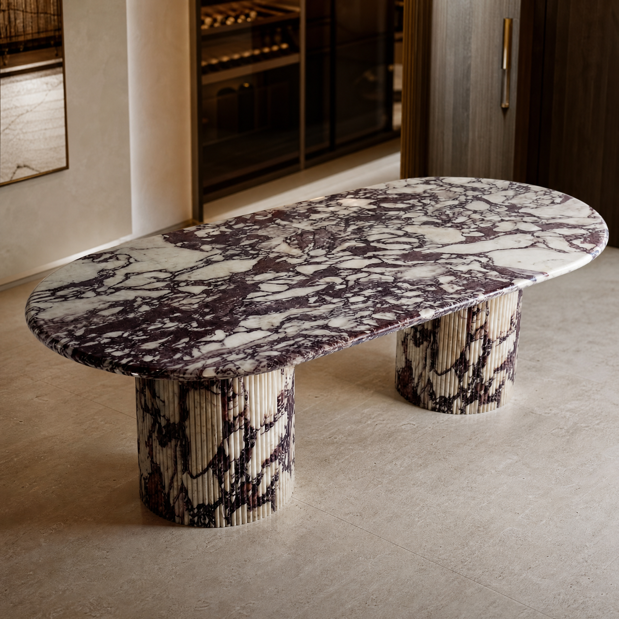 Close-up detail of the natural wine and plum-toned veining on the fluted base and surface of the Calacatta Viola marble oval dining table.